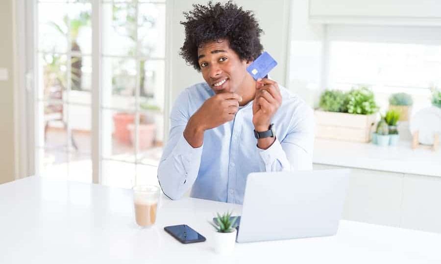 bigstock-African-American-man-using-lap-293273896