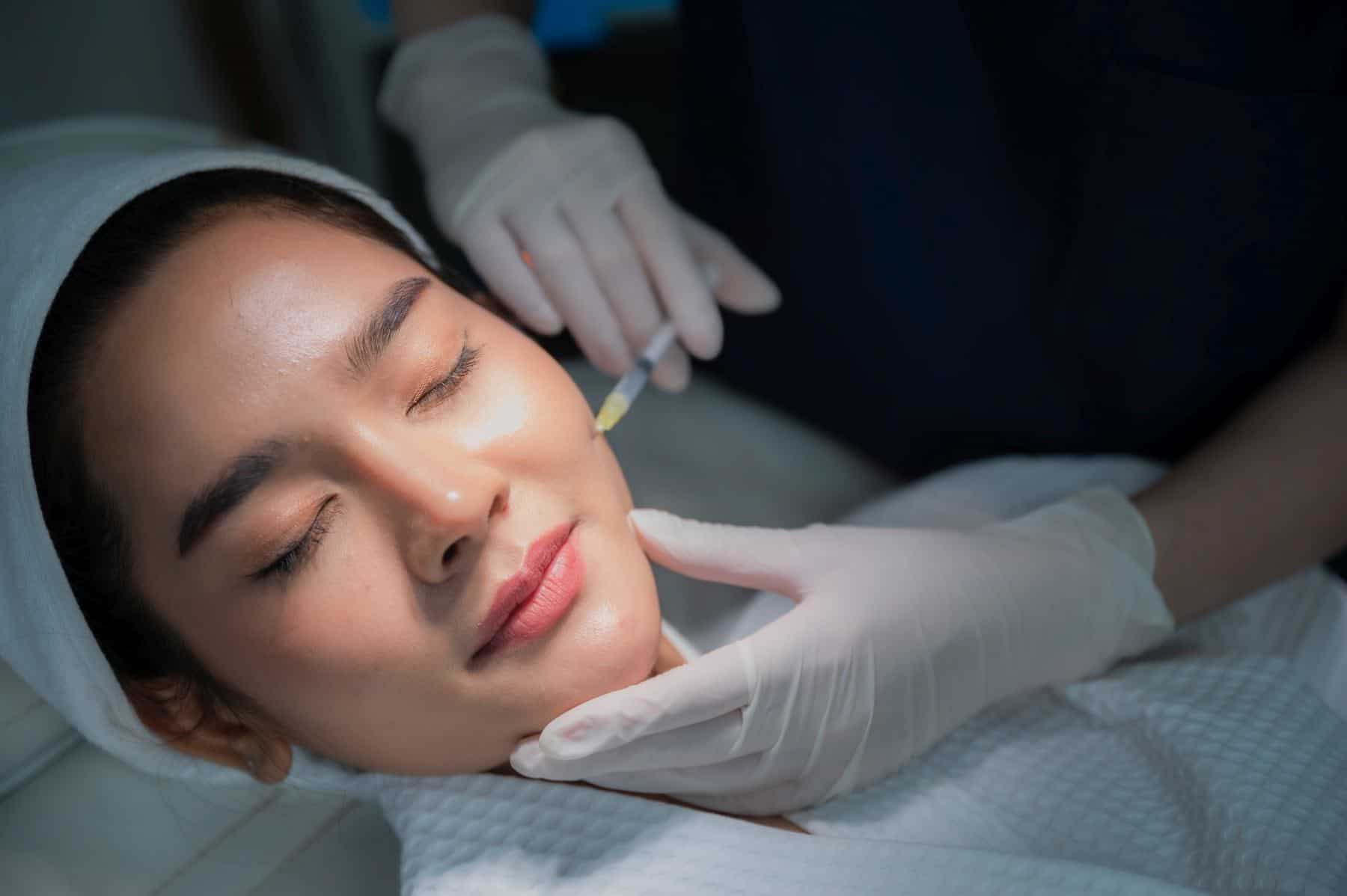 young asian woman getting botox treatment